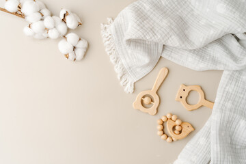 Baby muslin blanket and wooden toys for newborn