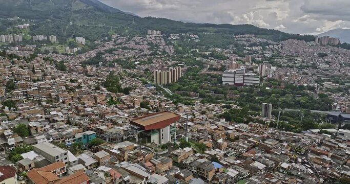 Medellin Colombia Aerial v42 drone flyover and around El Pinal Gondola lift station capturing Communa 8 and Villa Hermosa residential hillside neighborhoods - Shot with Mavic 3 Cine - November 2022