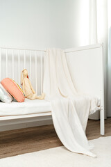 White wooden baby crib in nursery room - obrazy, fototapety, plakaty