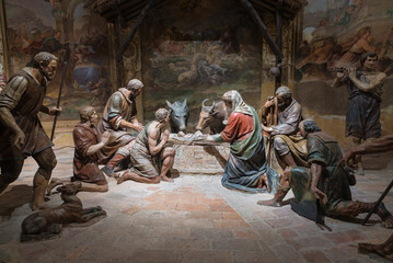Fototapeta premium Ancient nativity scene with wooden sculptures. Sacro Monte of Varese, Italy, Unesco site. Interior of the third chapel, about mid 1600 (authors dead for more than 300 years) 