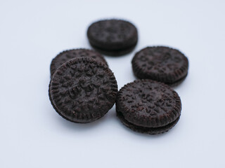 mini cookies with cream filling isolated on white background