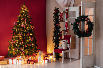 interior christmas. magic glowing tree, fireplace and gifts