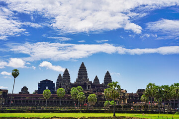 Angkor Wat Temple Complex reflected in the lake at mid day - UNESCO World Heritage 12th century...