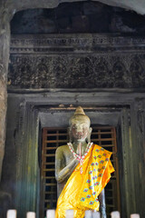 Buddha being worshipped inside the sanctum of Angkor Wat temple at Siem Reap, Cambodia, Asia
