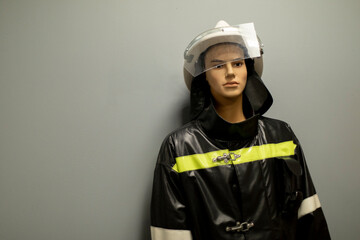 Fireman's mannequin. Fire worker's uniform. Figure of man in uniform.