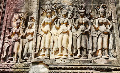 Apsara - Stone bas relief depicting Heavenly nymphs and celestial dancers at the courts of the...