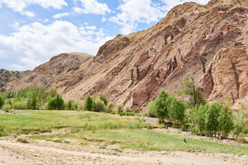 Mountain landscape with river and blue sky. Beautiful natural background.