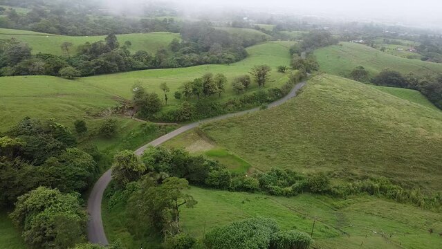 driving through the mountains in a modern SUV, aerial video, drone