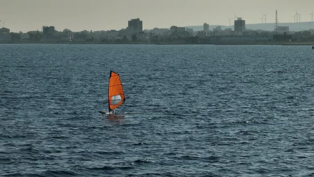 Aerial view active rest on the beach near the sea windsurfing. Extreme surfing on a board in the window. High quality 4k footage