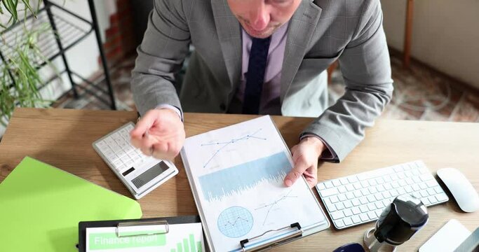 Angry aggressive boss yells at employee in office at workplace. Crisis distressed financial report and poor sales analytics