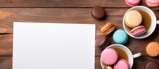 Flat lay of coffee pastries and notepad on wooden table