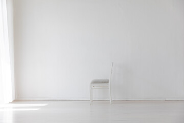 one vintage empty chair in white room interior