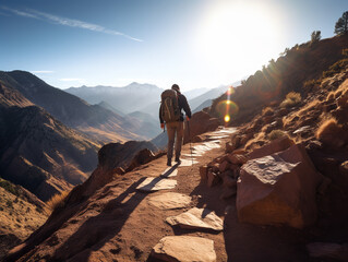 Fototapeta premium A hiker on a mountain trail, determined, natural outdoor lighting, scenic landscape shot
