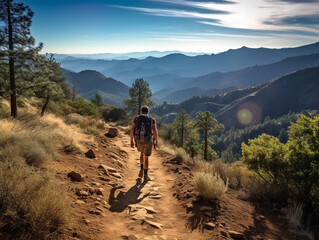 Obraz premium A hiker on a mountain trail, determined, natural outdoor lighting, scenic landscape shot
