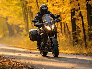 Obraz na płótnie Canvas A motorcyclist cruising through scenic fall countryside, adventurous