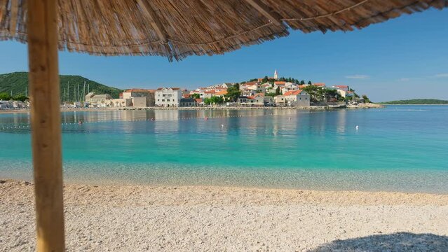 Idyllic beach near the charming Primosten town, Adriatic Sea in Croatia