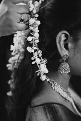 Gajra an Indian jewelry wore in hair with jhumka