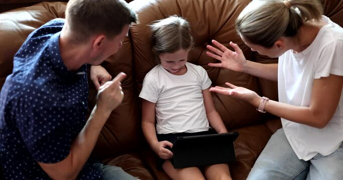 Parents Mom And Dad Scold Shouting At Child With Tablet. Children's Addiction To Gadgets