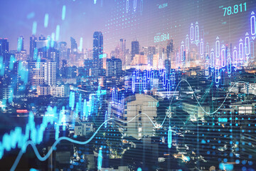 Creative glowing candlestick forex chart on blurry night city wallpaper. Stock market, trading...