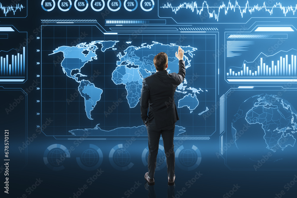 Aufkleber Back view of young businessman using glowing digital business charts and map interface on blurry background. Military control, warfare and spy concept.