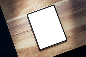 Top view of empty white tablet on wooden table. Mock up, 3D Rendering.