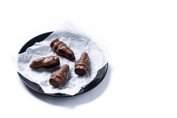 cheerful wrapped chocolate Santa Claus isolated on white background. Copy space
