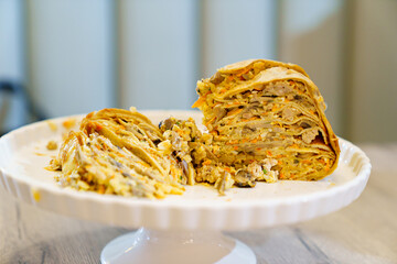 Pancake pie with meat and mushrooms. Traditional Russian kurnik pie. © andrey