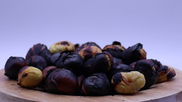 Fresh roasted chestnuts rotating on a turntable