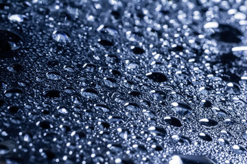 Drops of water on a color background. Selective focus. Gray