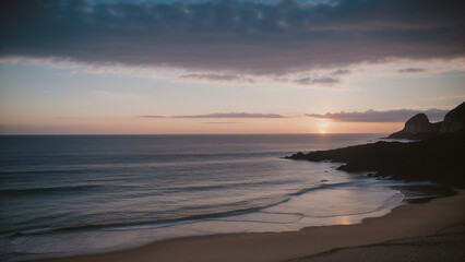 Fototapeta premium a beach with a sunset and a body of water