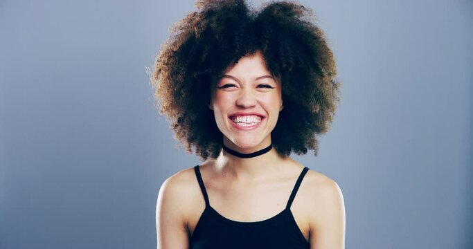 Portrait, woman with wink and afro in studio for like, opportunity or secret deal agreement gesture. Flirt emoji, romantic offer and face of happy person with confidence, grunge and grey background.