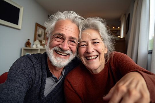 Virtual Togetherness: Happy Senior Couple Embracing Technology, Sharing Smiles and Love During a Heartwarming Video Call at Home