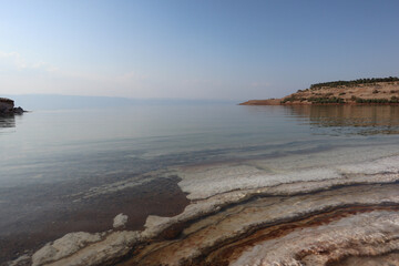 Unique landscape of the white salt stone at the salt beach in the dead sea area