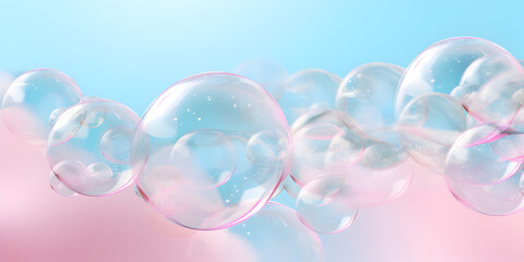 Transparent abstract soap bubbles on soft blue and pink background 
