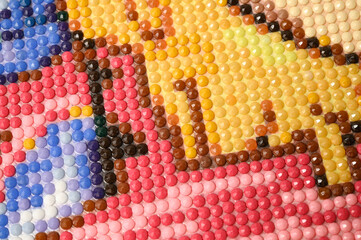 Multicolored diamond mosaic close-up.