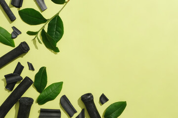 The left corner of the frame is decorated with bamboo charcoal and fresh green tea leaves. The remaining space is for text design and product image insertion. Commercial space.