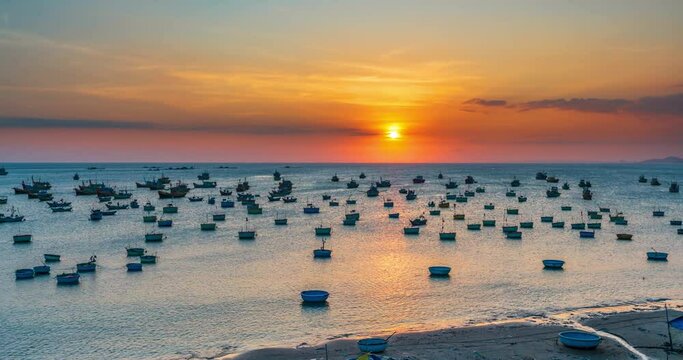 Time lapse of Mui Ne fishing village in sunset sky with hundreds of boats anchored to avoid storms, this is a beautiful bay in central Vietnam