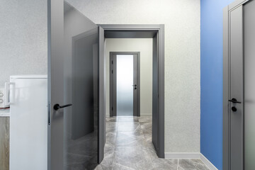 Grey door with glass insert in office building