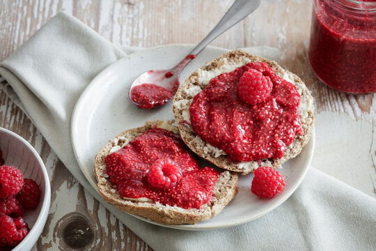Studio shot of spelt buns with raspberry jam