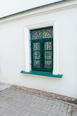 window with steel green grille. Metallic Pattern in Window