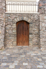 wooden door in stone wall