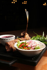 Grilled lamb ribs served on bbq