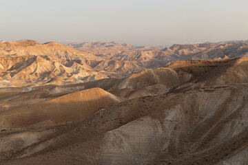Early morning light on the brown and barren Judean Desert in Israel