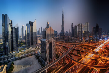 Fototapeta na wymiar Seamless day to night transition timelapse view of skyline of Downtown Dubai and busy Sheikh Zayed road intersection, United Arab Emirates
