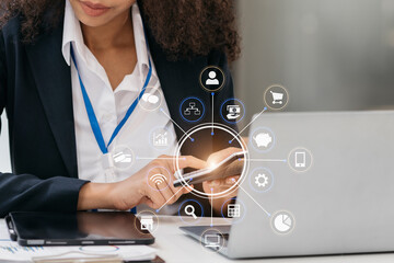 Businesswoman working with tablet and using a calculator to calculate the numbers of static in...