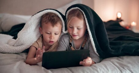 Smile, tablet and children on bed with blanket relaxing, bonding and doing elearning online. Happy, digital technology and kids laying and play games in bedroom together on weekend in house at night.