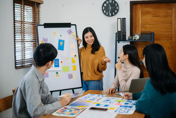  UX developer and ui designer brainstorming about mobile app interface wireframe design with...