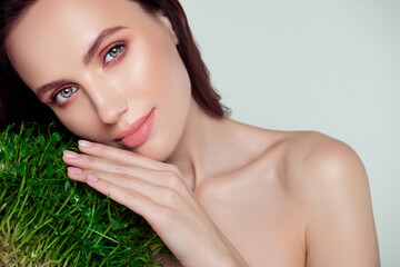 Photo of attractive gentle tender lady touch green plant enjoy new bio extract in cream for soft...