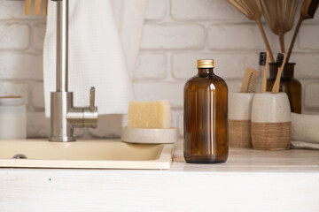 Recycled plastic pump bottle for mockup on white brick wall background near sink