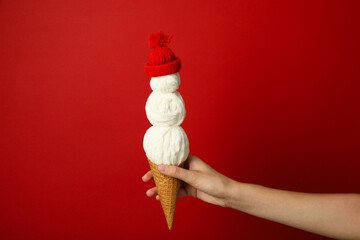 A waffle cone with a decorative snowman